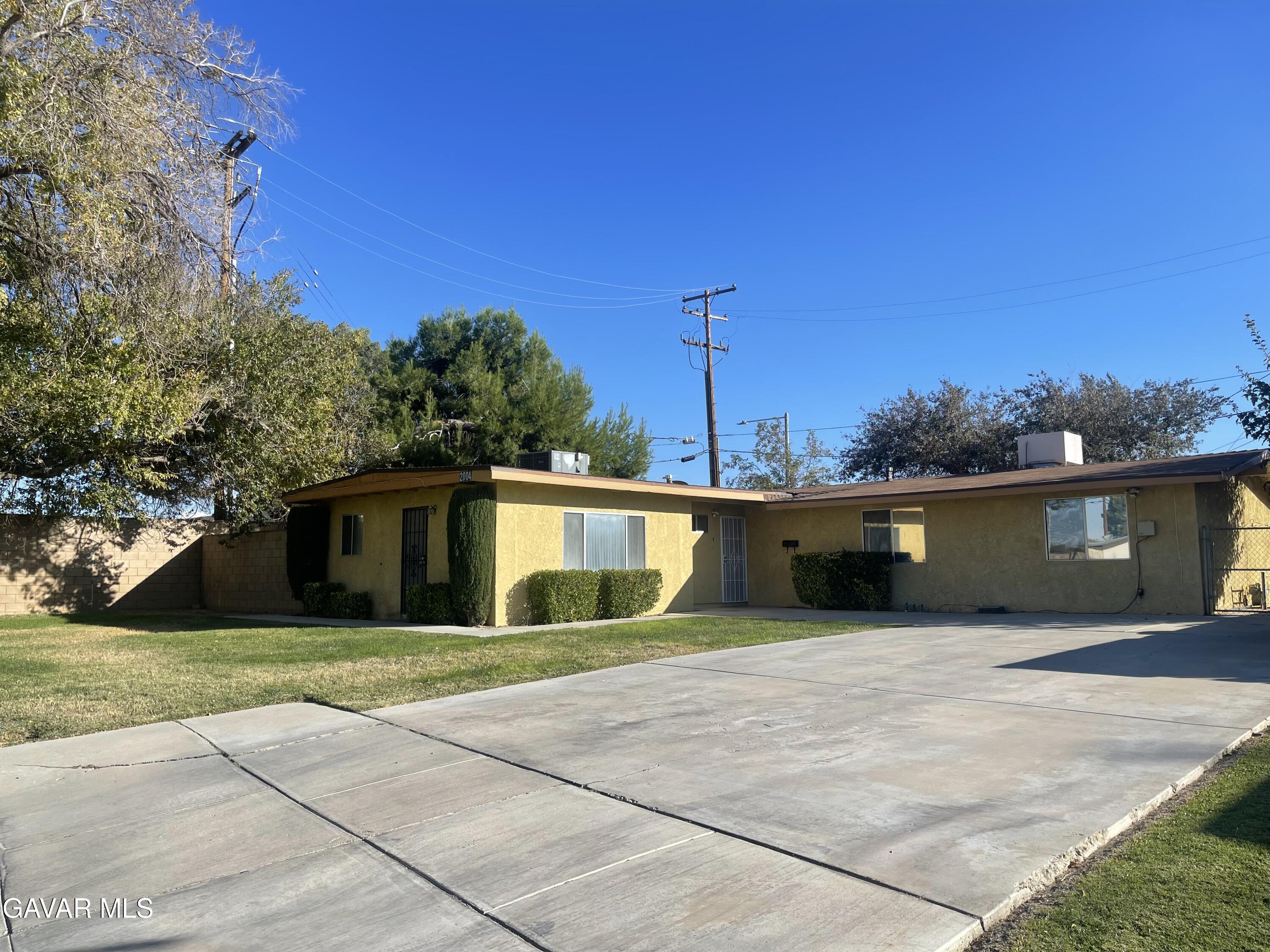2004 Oldfield Street, Unit B Lancaster, CA 93536 - Photo 2 of 12 a house view with a backyard space
