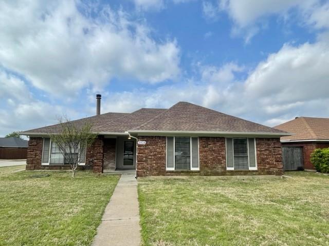 a front view of a house with a garden and porch