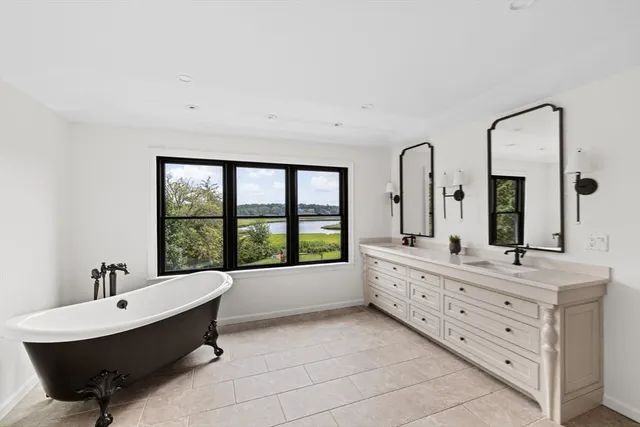 a living room with furniture a rug and a window
