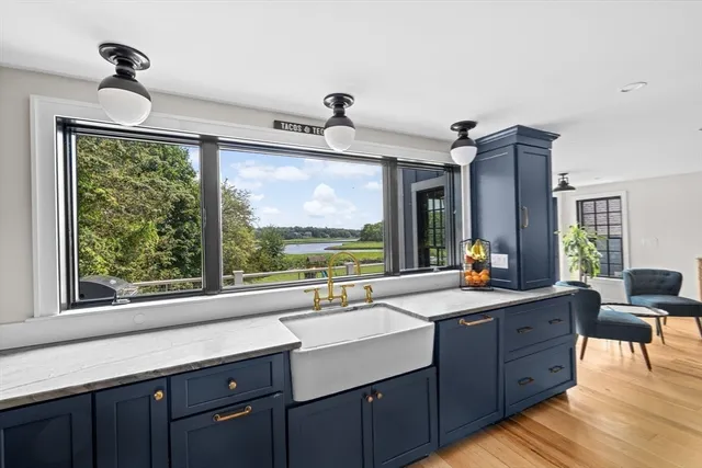 a bedroom with a large bed and a large window