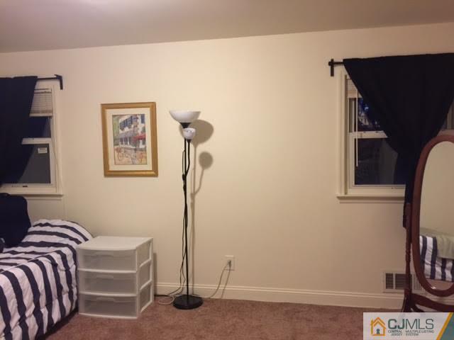 23 Richmond Road Edison, NJ 08817 - Photo 5 of 13 a bedroom with a bed and furniture
