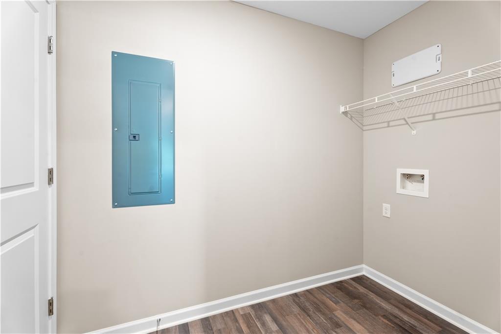 31 Whiterock Road Phenix City, AL 36869 - Photo 30 of 36 Laundry room with electric panel, washer hookup, and dark wood finished floors