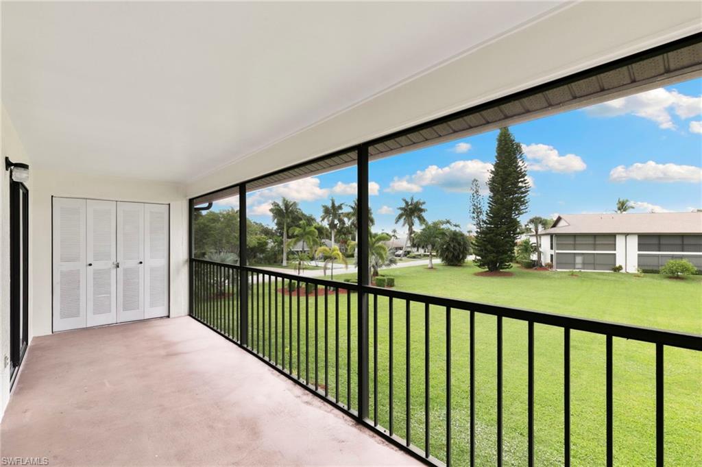 236 Pebble Beach Circle, Unit A202 Naples, FL 34113 - Photo 18 of 25 a view of a city from a balcony