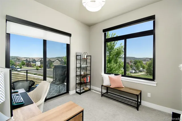 a view of a balcony with lake view and wooden floor