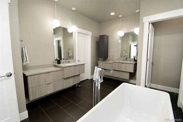 a living room with furniture and a walk in closet