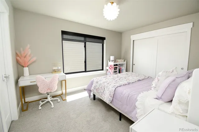 a bathroom with a double vanity sink mirror and toilet