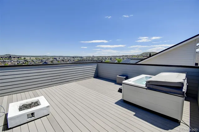 a view of roof deck with furniture