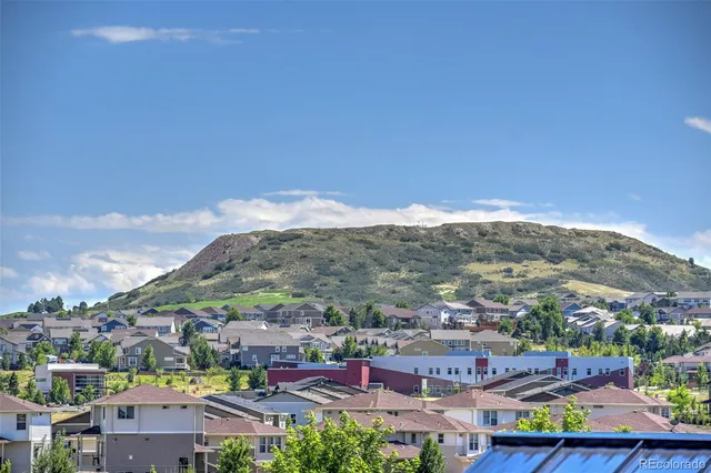 a view of a garden with a building in the background