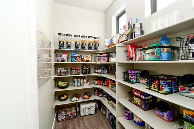 a room with lots of books and a book shelf
