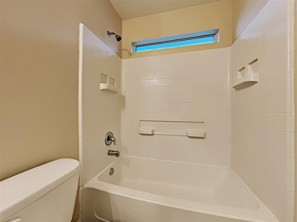 21535 Micheala Way Humble, TX 77338 - Photo 13 of 17 a bathroom with a bathtub and a shower