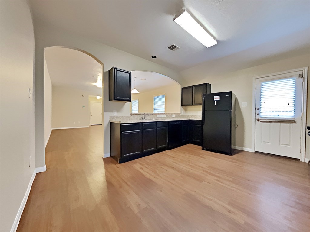 21535 Micheala Way Humble, TX 77338 - Photo 3 of 17 a kitchen with granite countertop a sink and cabinets