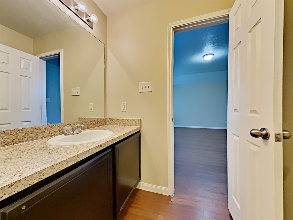 21535 Micheala Way Humble, TX 77338 - Photo 8 of 17 a bathroom with a granite countertop sink and a mirror