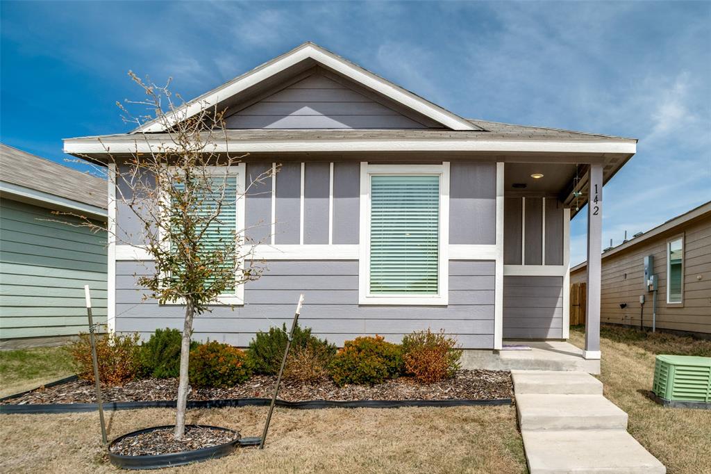 142 Sesame Lane Princeton, TX 75407 - Photo 12 of 15 a front view of a house with garden