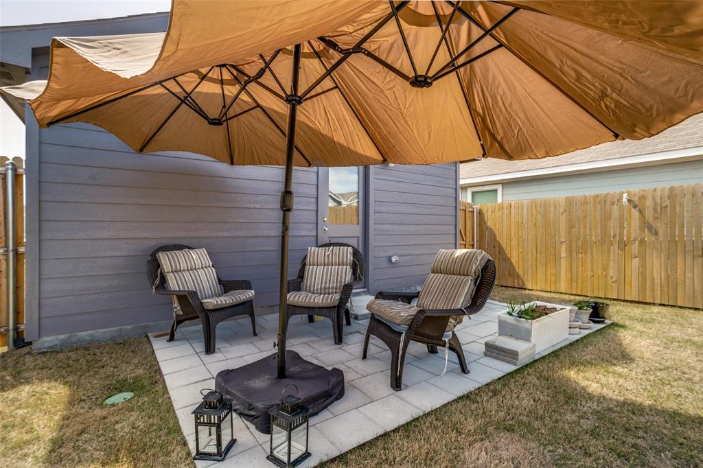 142 Sesame Lane Princeton, TX 75407 - Photo 13 of 15 a patio with table and chairs