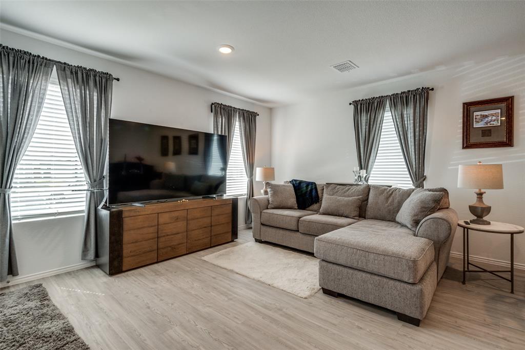 142 Sesame Lane Princeton, TX 75407 - Photo 2 of 15 a living room with furniture and a flat screen tv