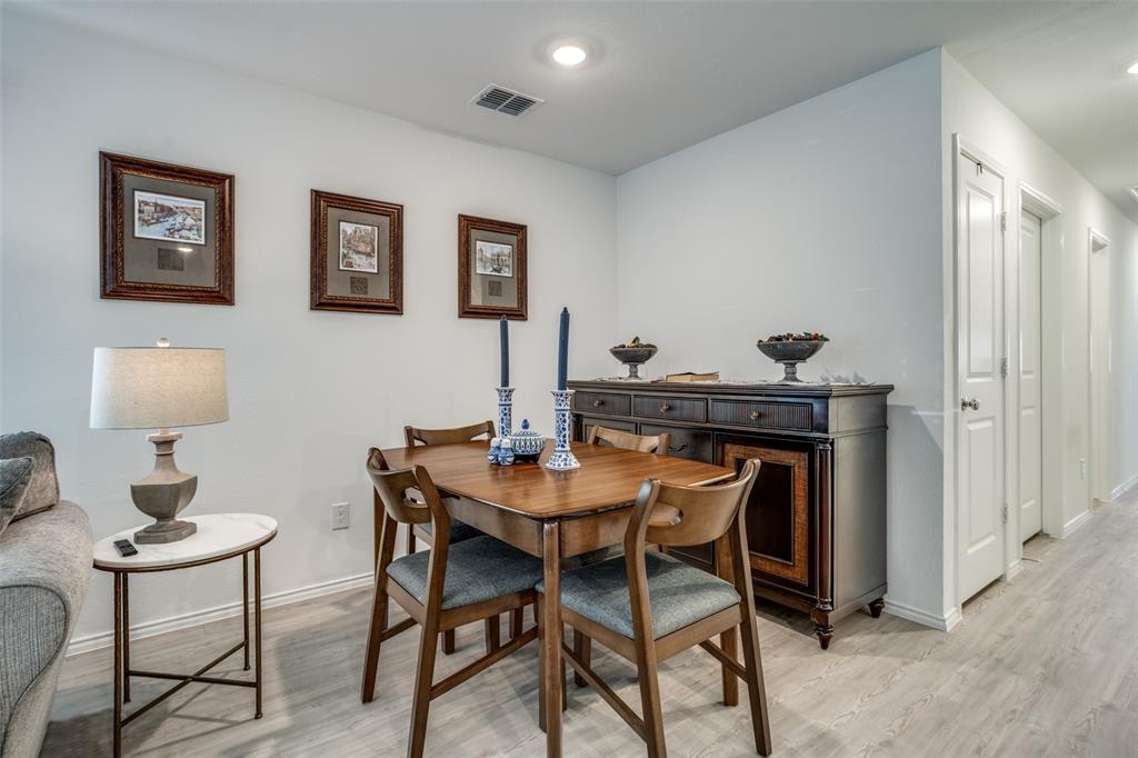 142 Sesame Lane Princeton, TX 75407 - Photo 3 of 15 a view of a dining room with furniture and wooden floor