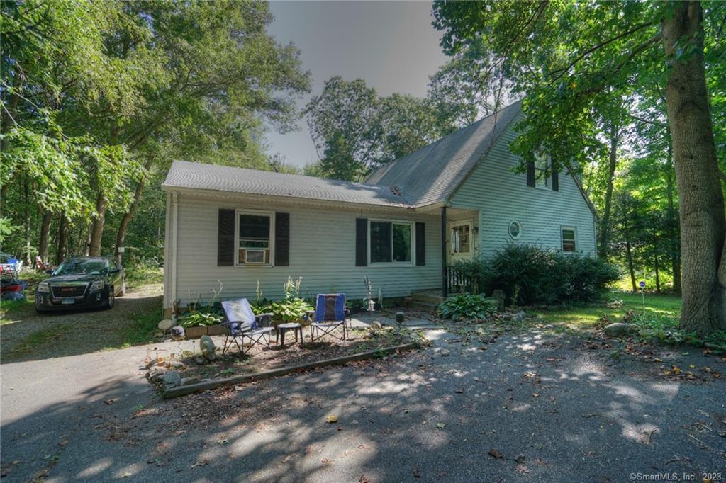 14-16 Marcel Road Groton, CT 06355 - Photo 1 of 1 a front view of a house with garden