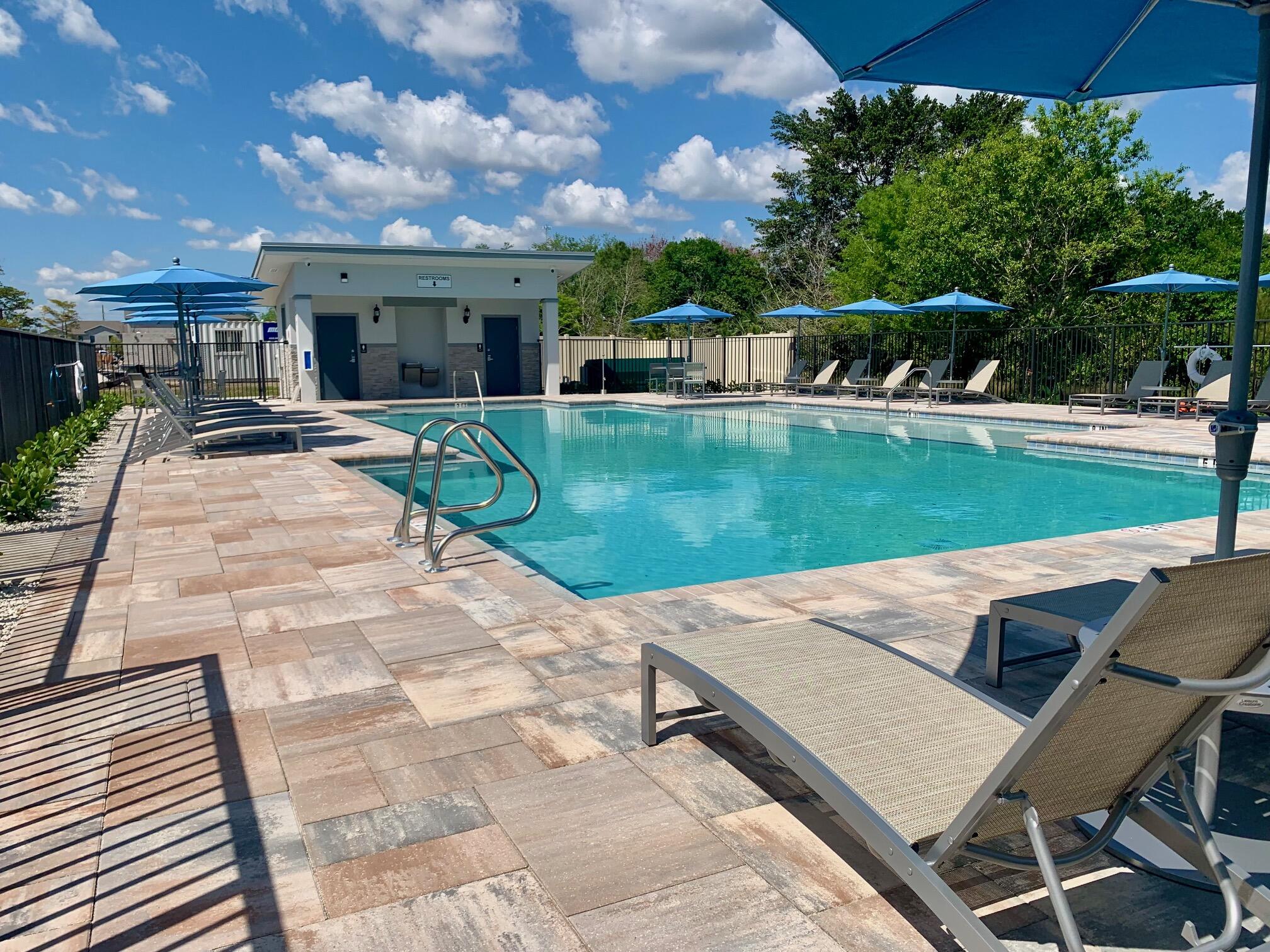 7790 Southwest Bentley Lane, Unit NAUTICAL 8015 Stuart, FL 34997 - Photo 18 of 22 a view of a house with backyard porch and sitting area