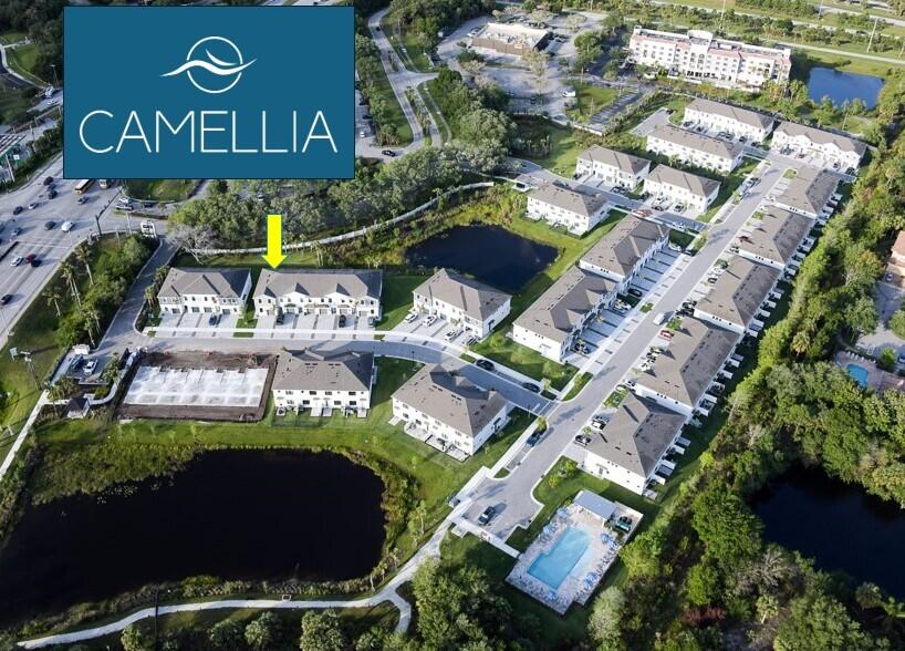 7790 Southwest Bentley Lane, Unit NAUTICAL 8015 Stuart, FL 34997 - Photo 2 of 22 an aerial view of swimming pool