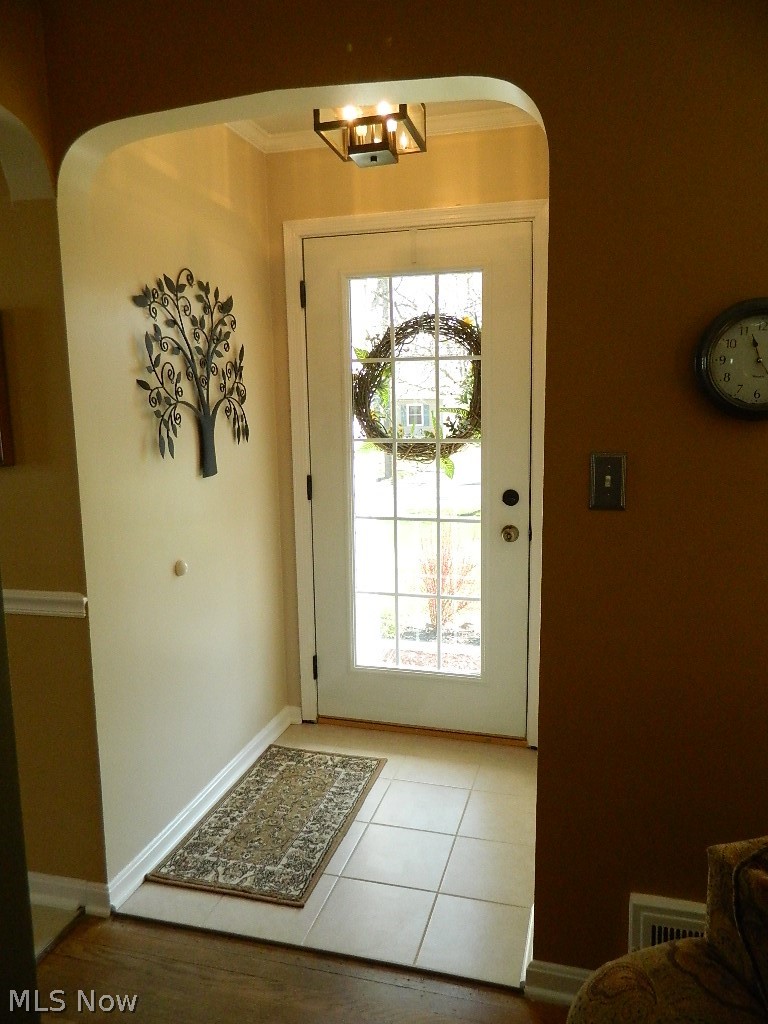 1604 Lyndhurst Road Lyndhurst, OH 44124 - Photo 2 of 35 Ceramic Foyer Entry with Guest Closet - Newer Light Fixture and 15 Light Entry Door and Storm Door!