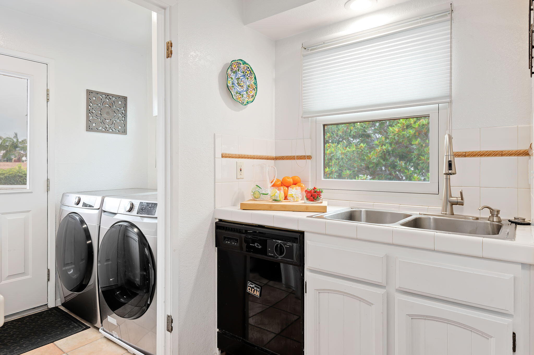 Undisclosed Address Santa Barbara, CA 93101 - Photo 11 of 23 a kitchen with a sink and a washer dryer