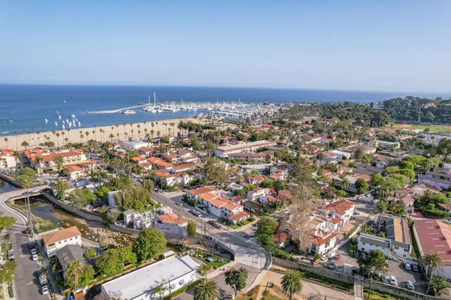 an aerial view of residential building and ocean