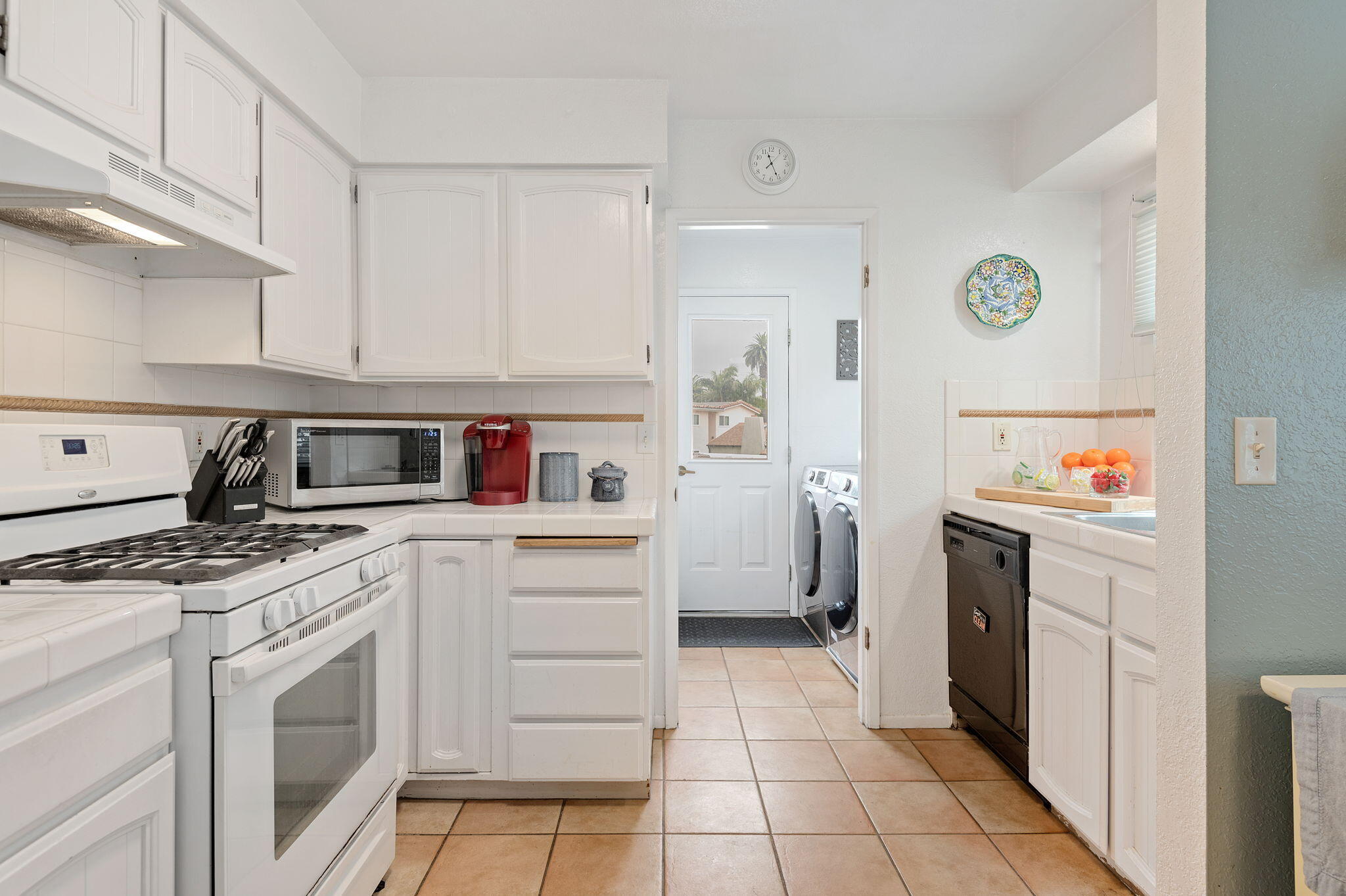 Undisclosed Address Santa Barbara, CA 93101 - Photo 10 of 23 a kitchen with stainless steel appliances granite countertop a stove a sink and a refrigerator