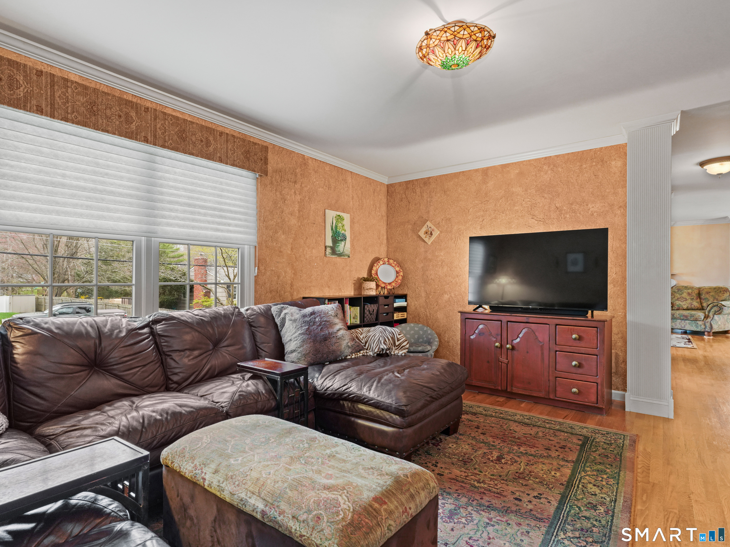 82 Ramapoo Road Ridgefield, CT 06877 - Photo 15 of 40 a living room with furniture and a flat screen tv