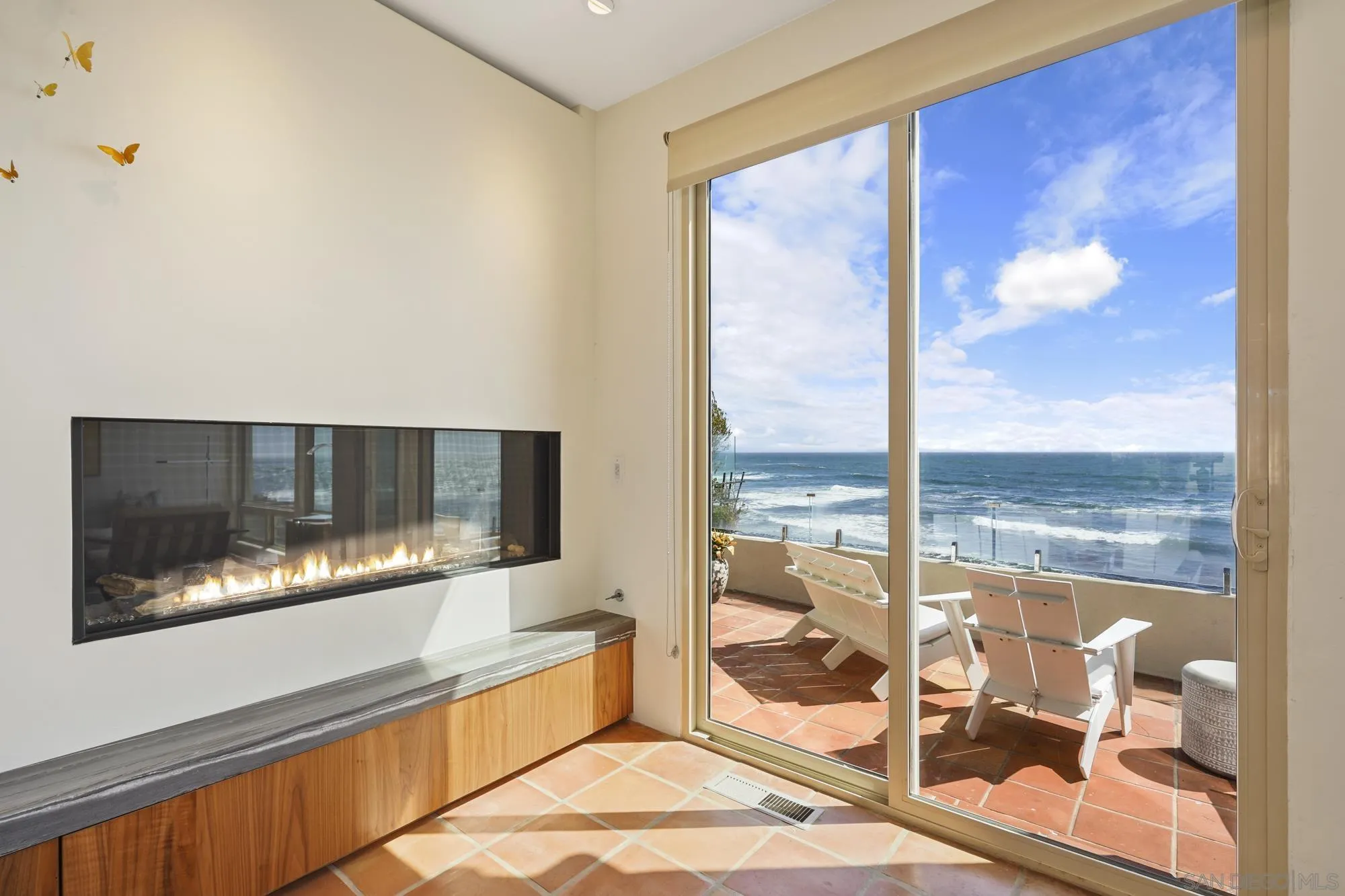 5650 Dolphin Place La Jolla, CA 92037 - Photo 14 of 54 a living room with a large window and a table