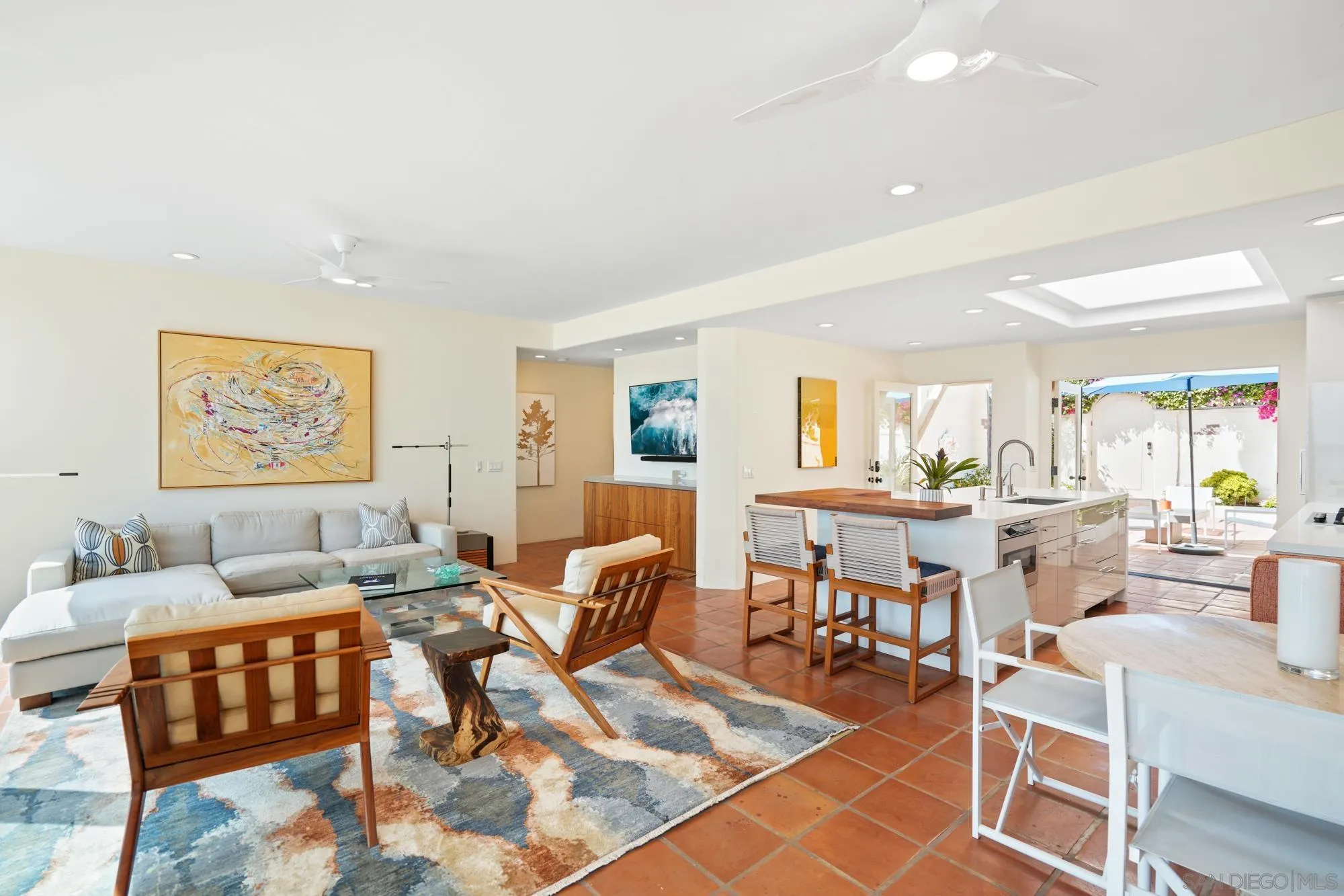 5650 Dolphin Place La Jolla, CA 92037 - Photo 17 of 54 a living room with lots of furniture and a rug