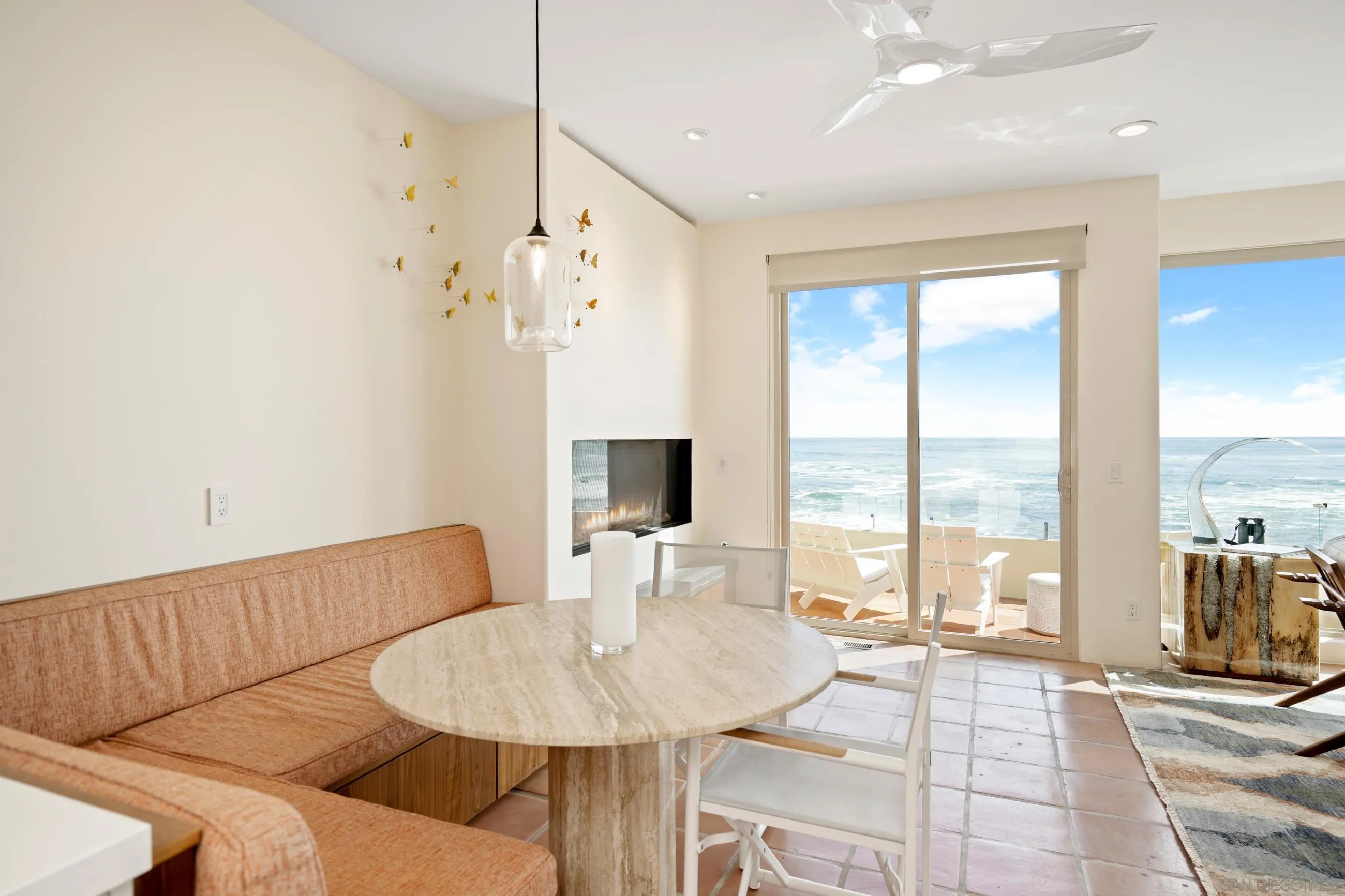 5650 Dolphin Place La Jolla, CA 92037 - Photo 19 of 54 a living room with furniture and a floor to ceiling window