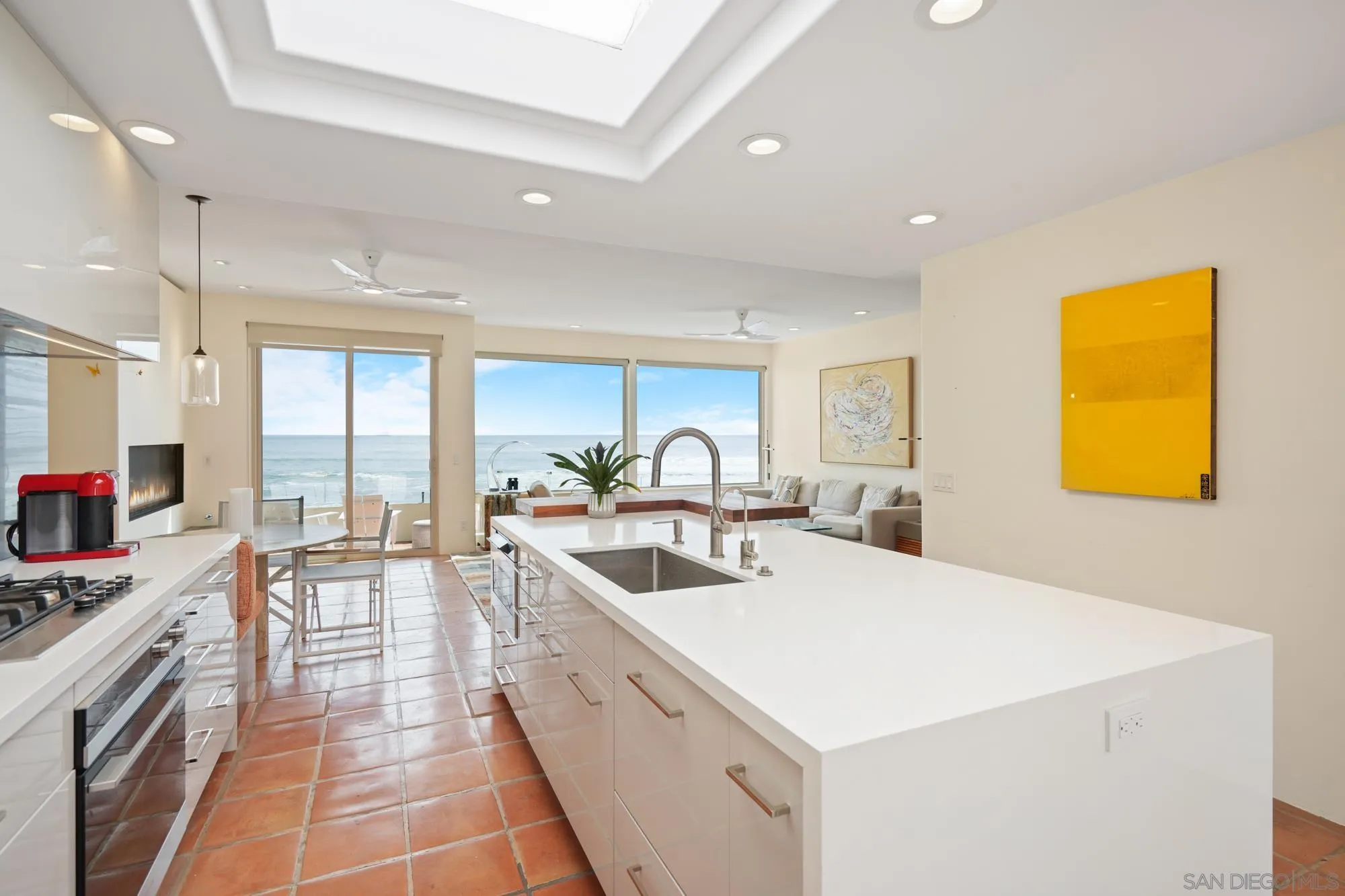 5650 Dolphin Place La Jolla, CA 92037 - Photo 20 of 54 a large white kitchen with a large window