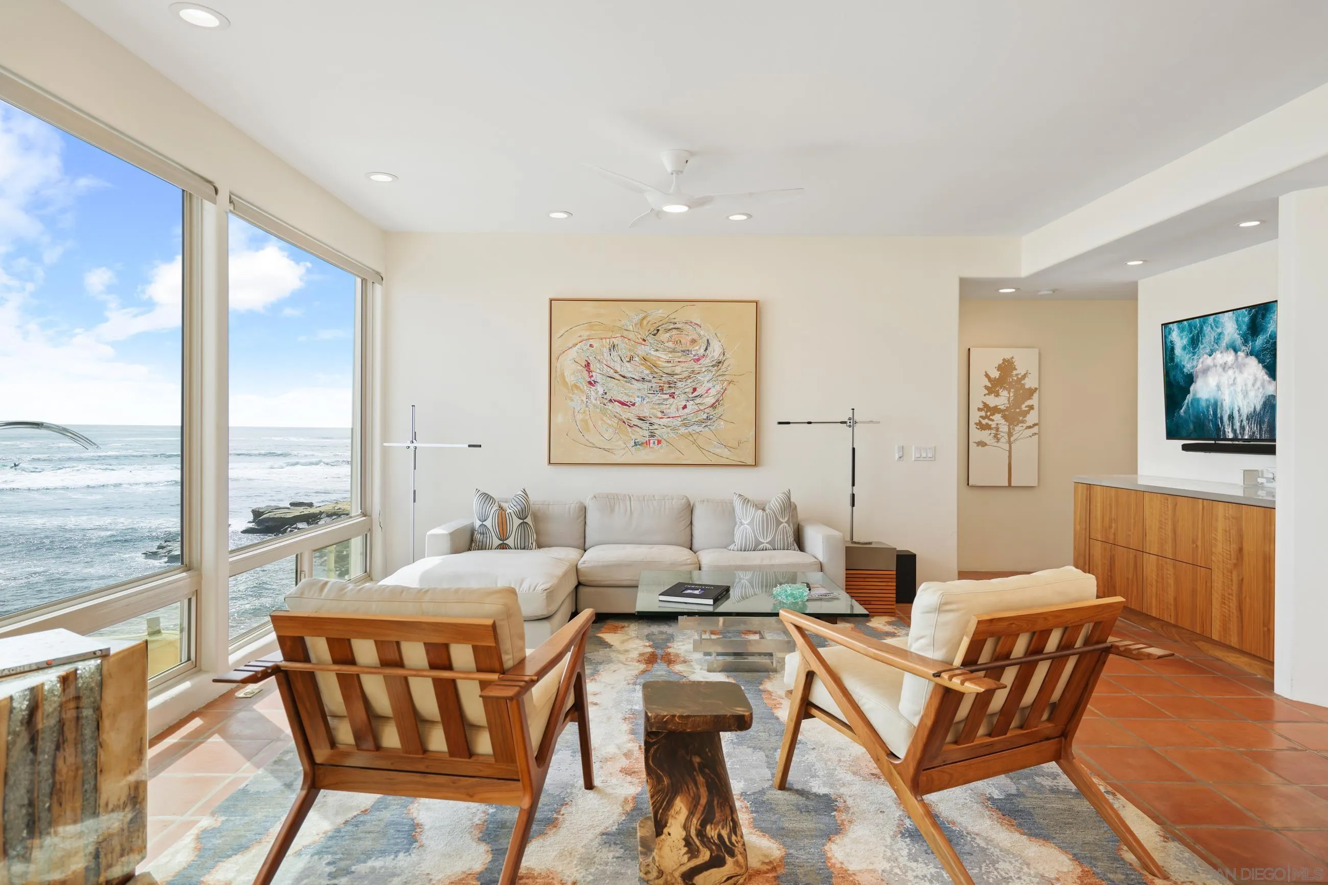 5650 Dolphin Place La Jolla, CA 92037 - Photo 21 of 54 a living room with furniture and a large window