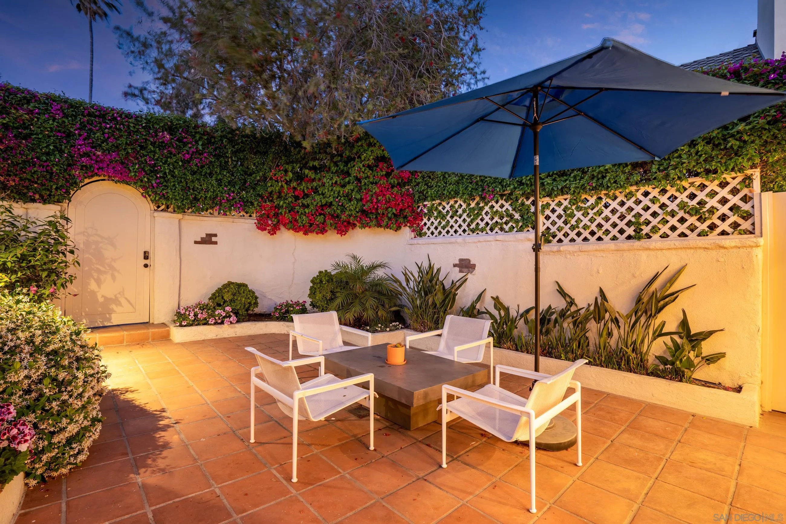 5650 Dolphin Place La Jolla, CA 92037 - Photo 25 of 54 a view of a chairs and table in the backyard