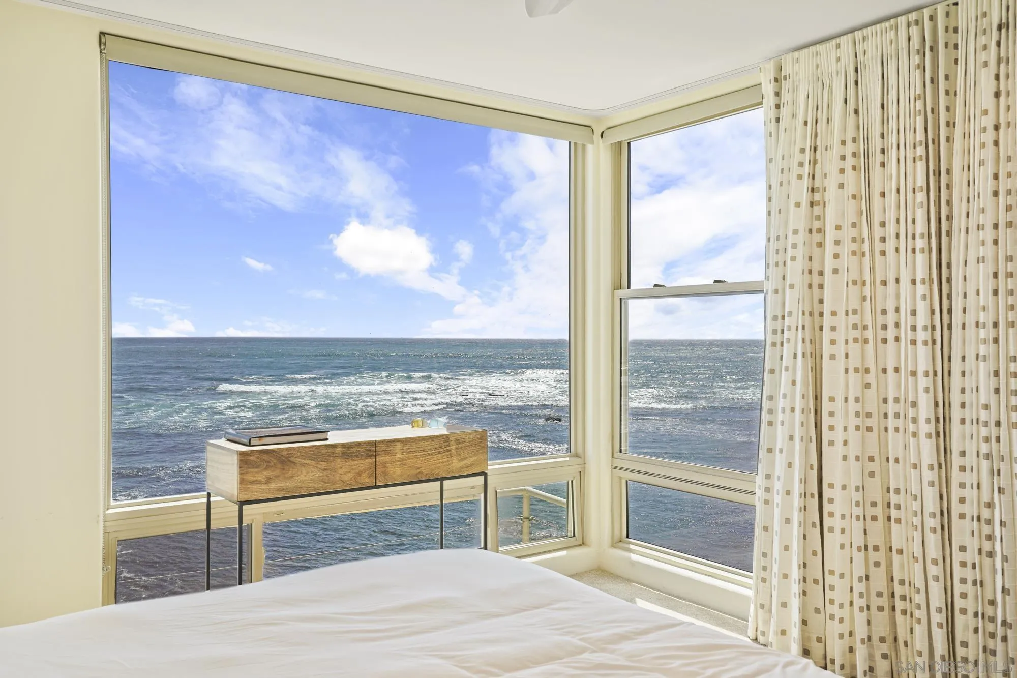 5650 Dolphin Place La Jolla, CA 92037 - Photo 31 of 54 a view of a livingroom with wooden floor and kitchen view