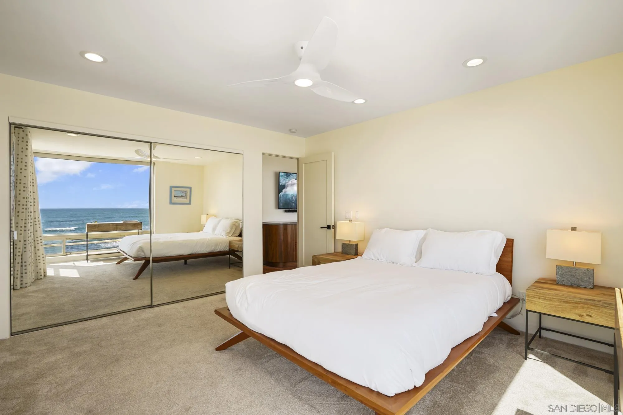 5650 Dolphin Place La Jolla, CA 92037 - Photo 33 of 54 a bedroom with a bed and window