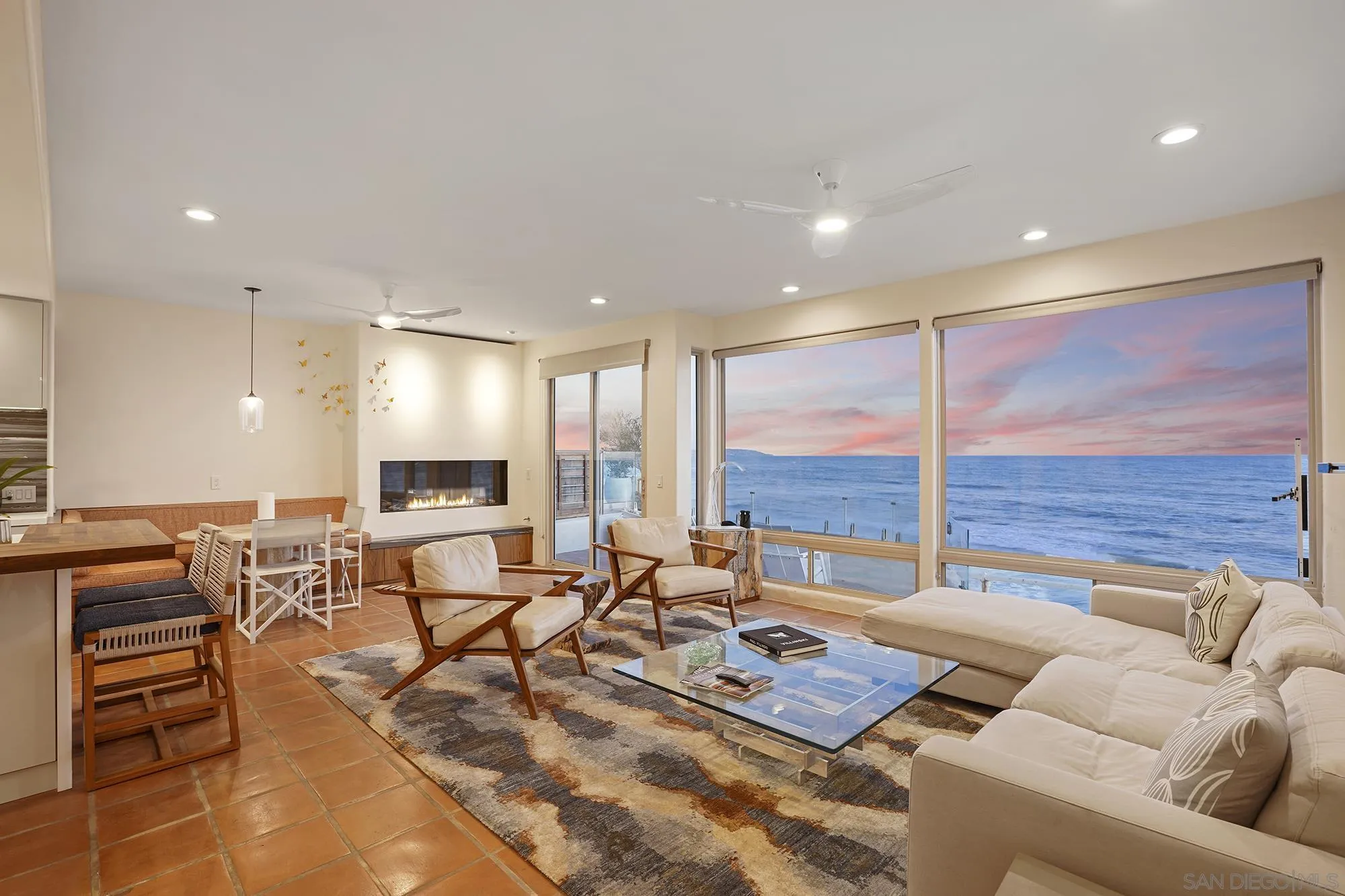 5650 Dolphin Place La Jolla, CA 92037 - Photo 6 of 54 a living room with furniture and a large window