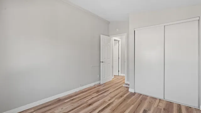 a view of room with wooden floor
