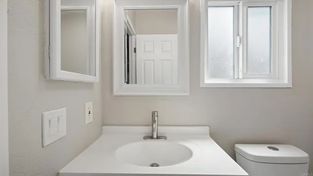 a bathroom with a sink and a toilet