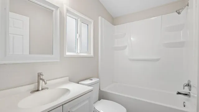 a bathroom with a sink toilet and bathtub