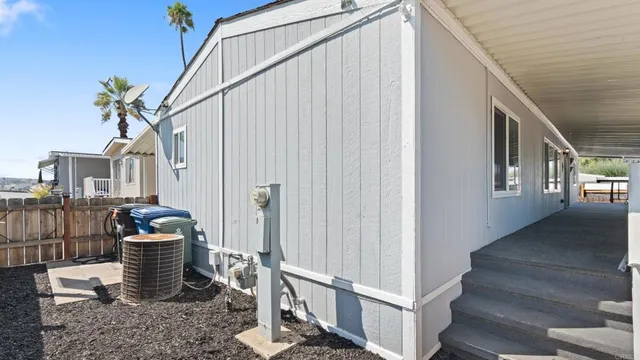 a close view of a chairs and table in the balcony