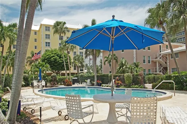 a view of a chairs and table in the patio