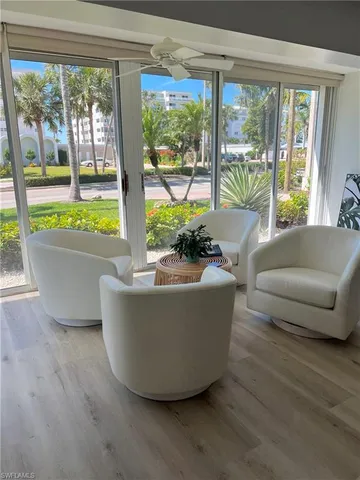 a living room with couch and a window