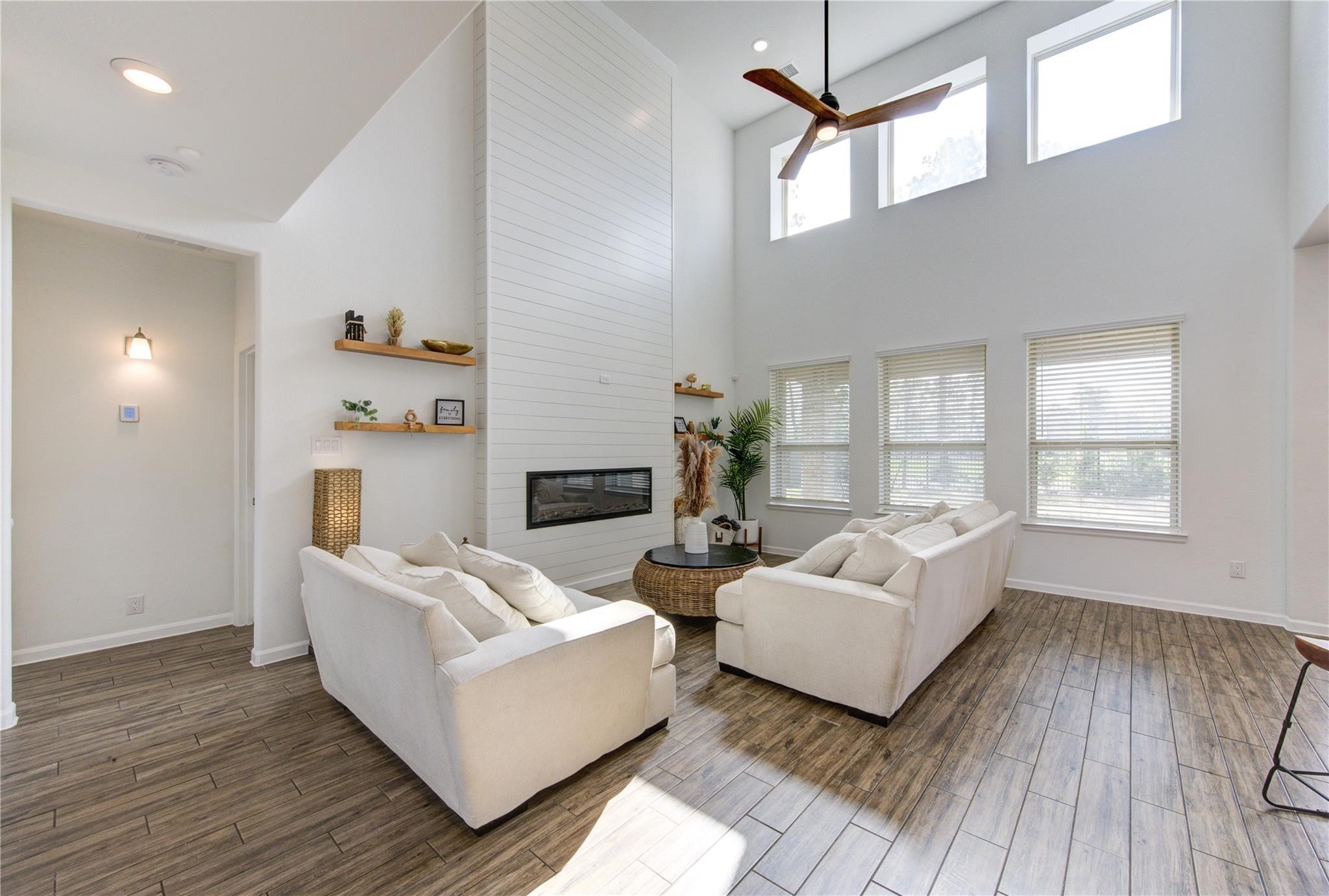 17530 Sunset Skies Road Conroe, TX 77302 - Photo 11 of 47 a living room with furniture and a wooden floor