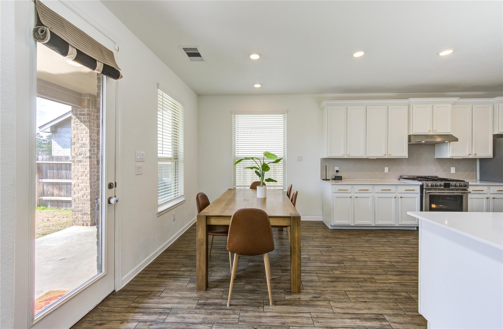 17530 Sunset Skies Road Conroe, TX 77302 - Photo 15 of 47 a view of kitchen with granite countertop cabinets and dining table