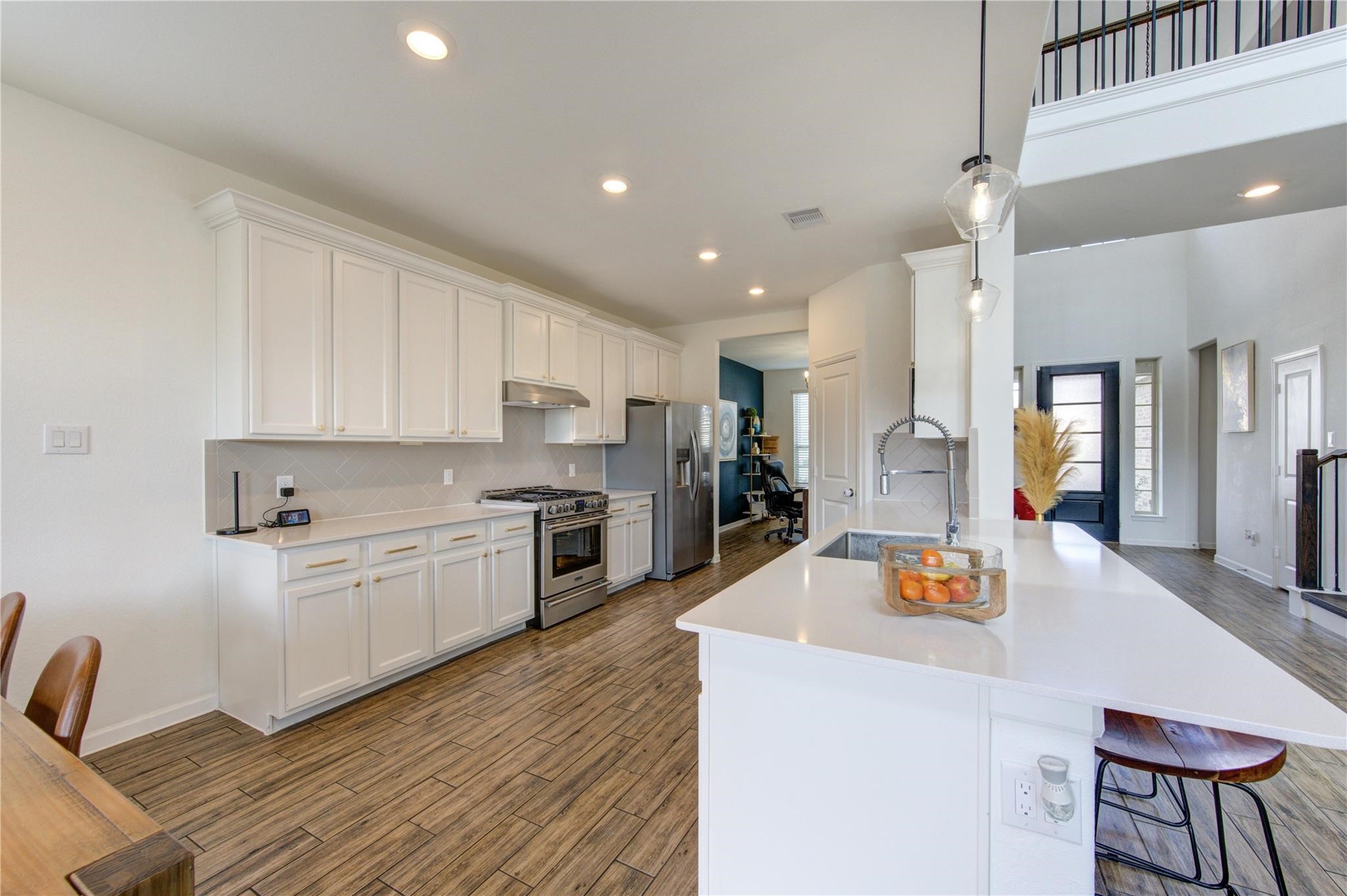 17530 Sunset Skies Road Conroe, TX 77302 - Photo 16 of 47 a large kitchen with a table and chairs in it