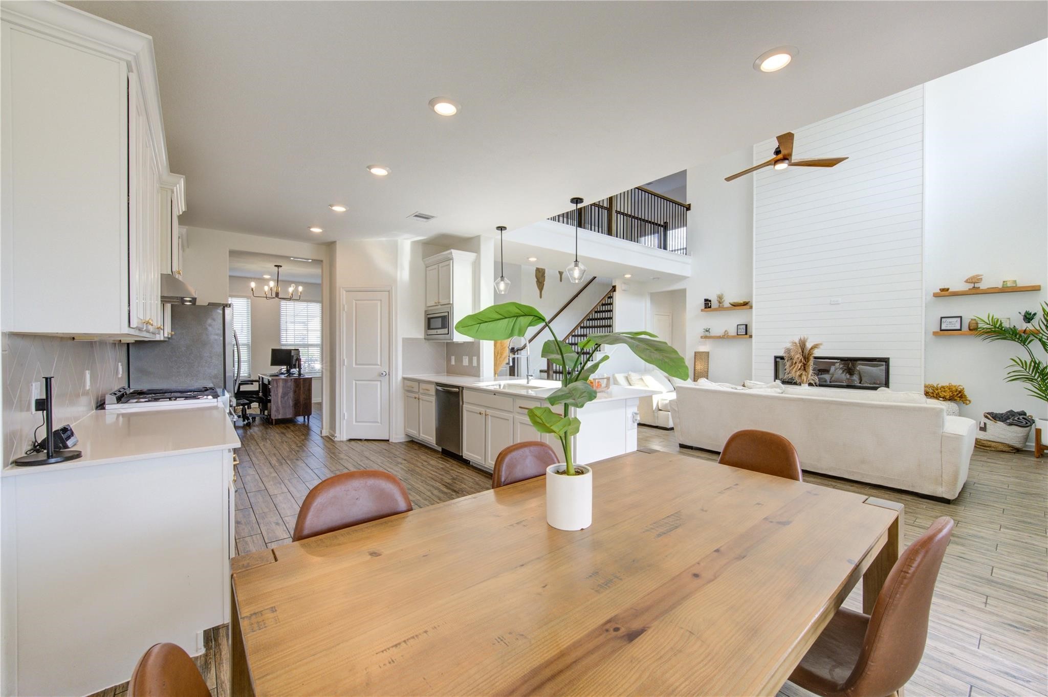 17530 Sunset Skies Road Conroe, TX 77302 - Photo 17 of 47 a living room with furniture and a kitchen view