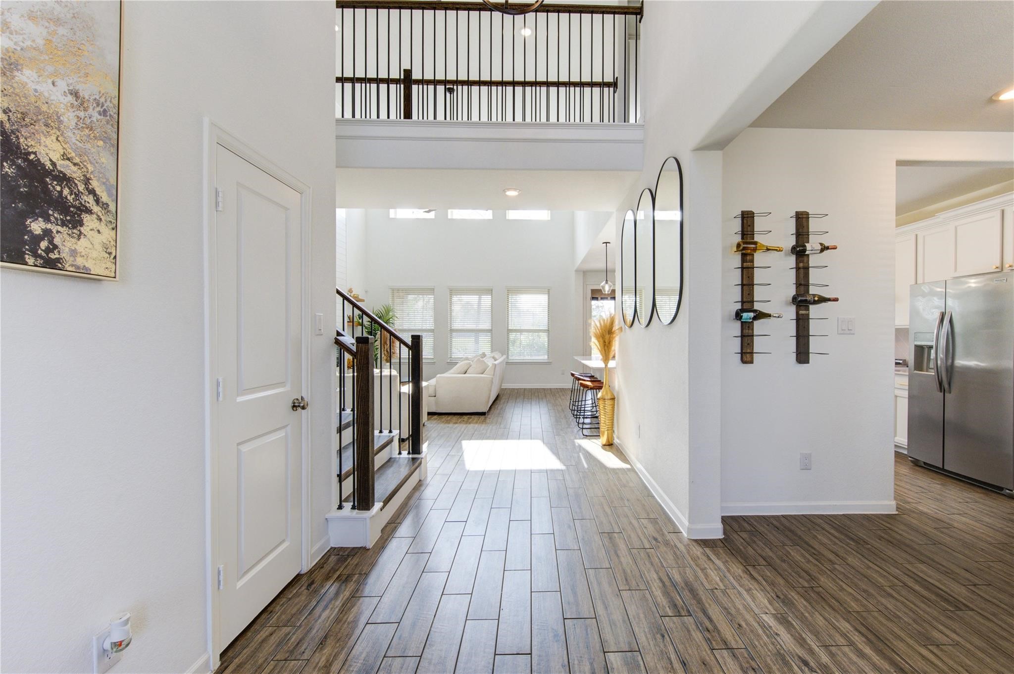 17530 Sunset Skies Road Conroe, TX 77302 - Photo 27 of 47 a view of a hallway view with wooden floor and staircase