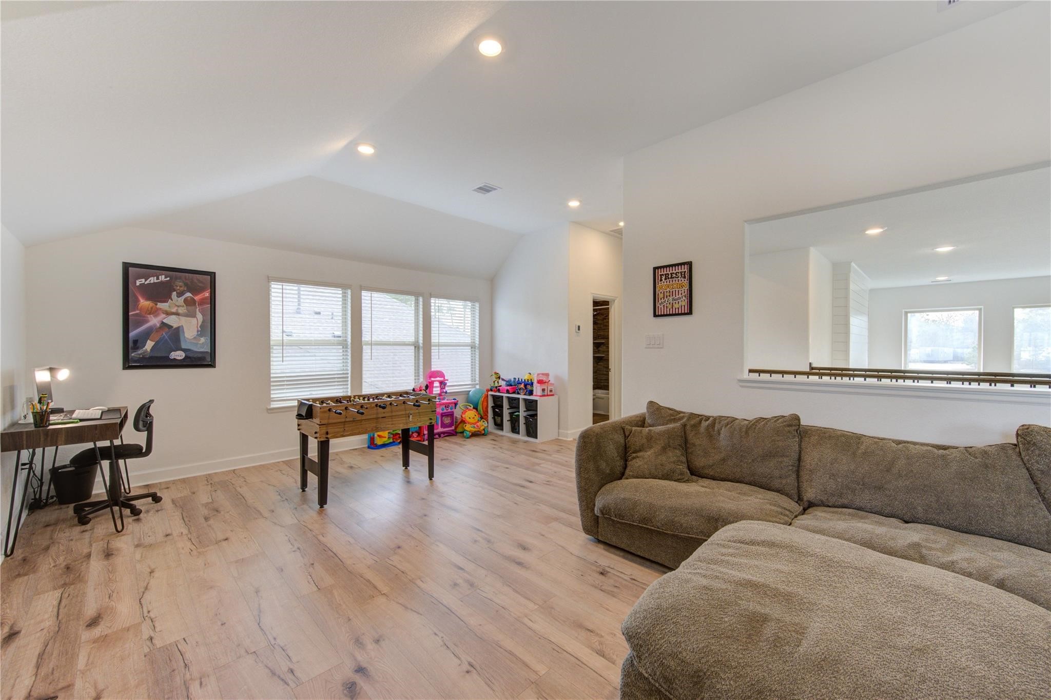 17530 Sunset Skies Road Conroe, TX 77302 - Photo 33 of 47 a living room with furniture and a wooden floor