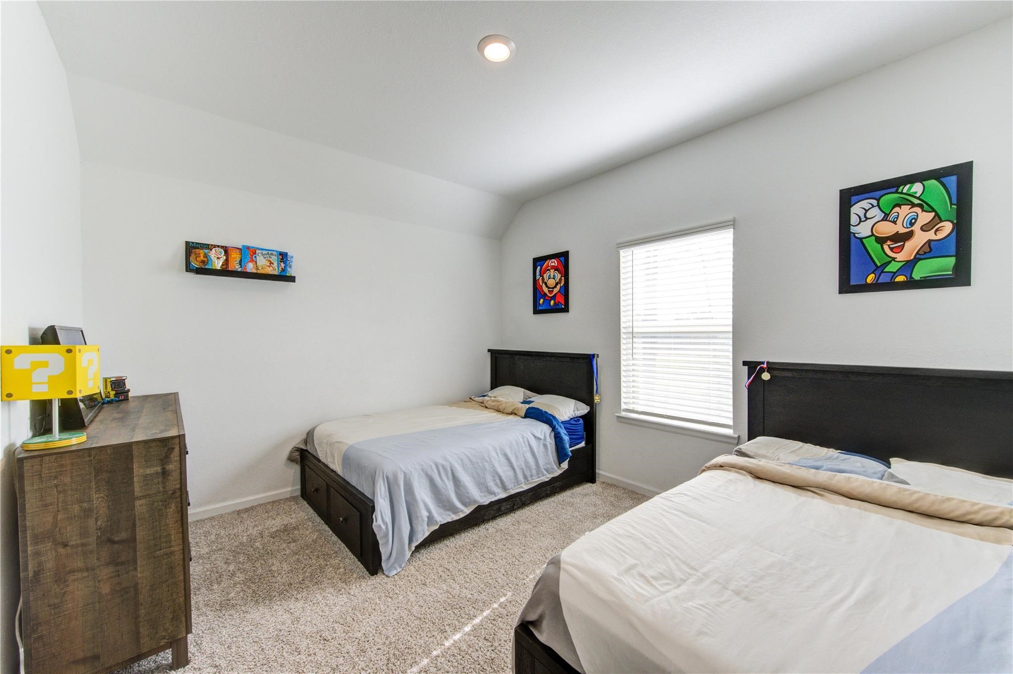 17530 Sunset Skies Road Conroe, TX 77302 - Photo 35 of 47 a bedroom with two beds and a couch